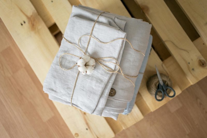 Stack of linen fabric to support the explanation of how sustainable linen is as a fabric