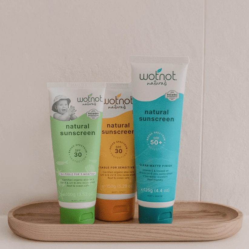 Range of Wotnot Naturals Sunscreens displayed on a tray
