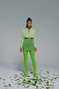 Woman wearing different shades of green clothing