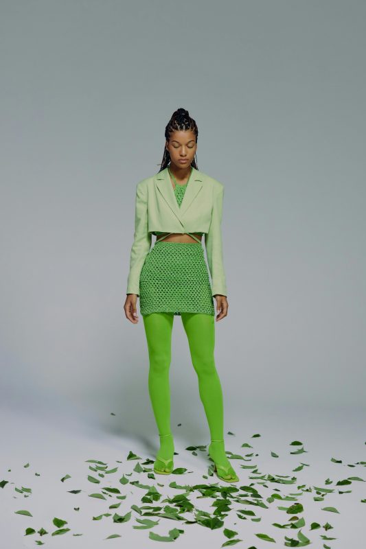 Woman wearing different shades of green clothing